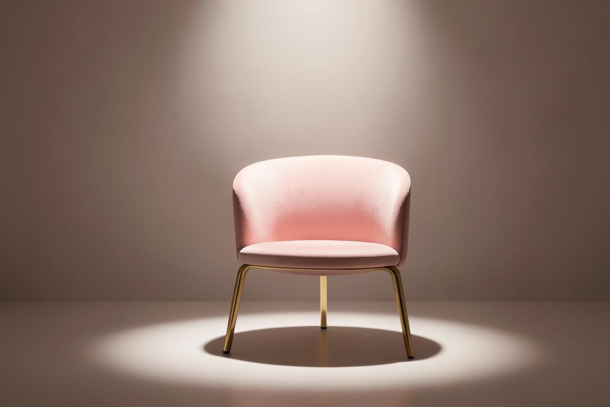 A single chair lit by a soft spotlight
